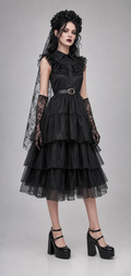 Gothic black rose tiered tulle dress worn by model with lace veil and accessories
