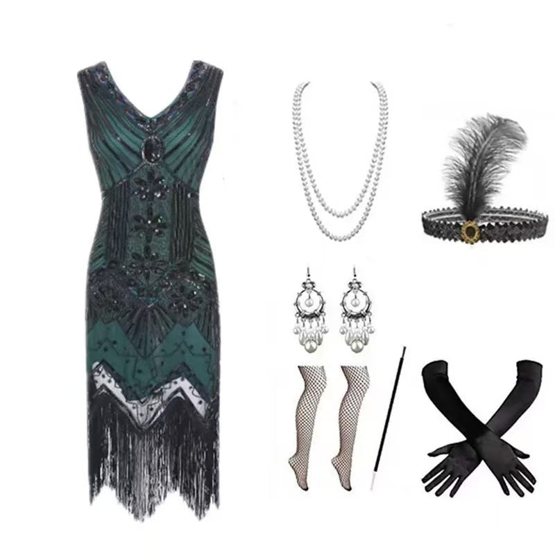 1920s emerald green flapper dress set flat lay showing dress and all accessories